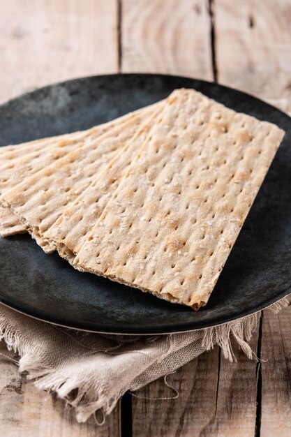 Traditional matzah bread on rustic wooden table