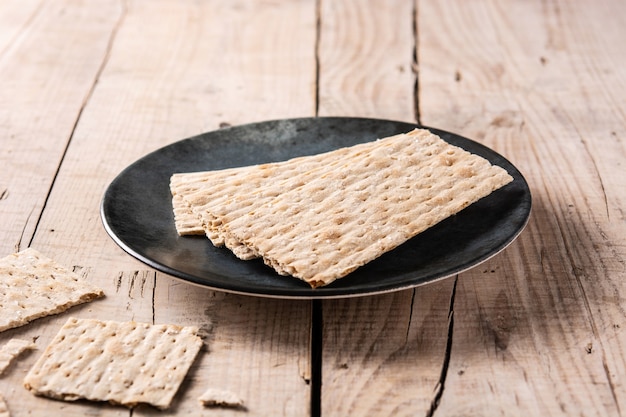 Traditional matzah bread on rustic wooden table