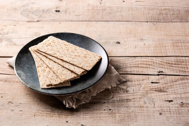 Traditional matzah bread on wooden table