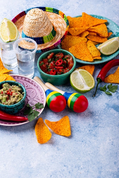 Traditional mexican food nachos salsa guacamole tequila