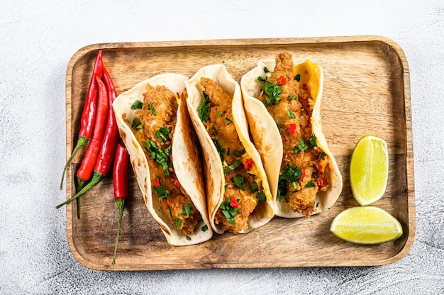 Traditional Mexican tacos with parsley cheese and chili peppers