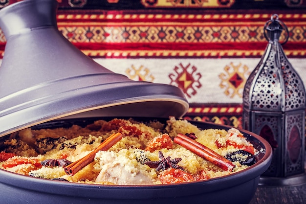 Traditional moroccan tajine of chicken with dried fruits and spices