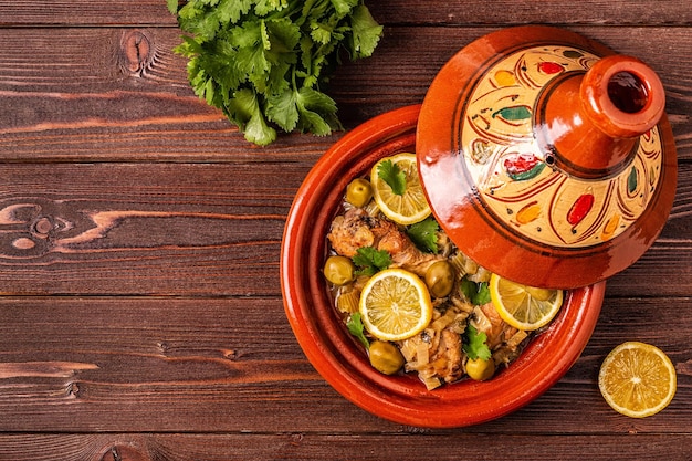 Traditional moroccan tajine of chicken with salted lemons olives