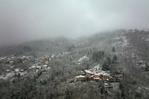 Traditional mountain remote cabins and houses in winter highlands