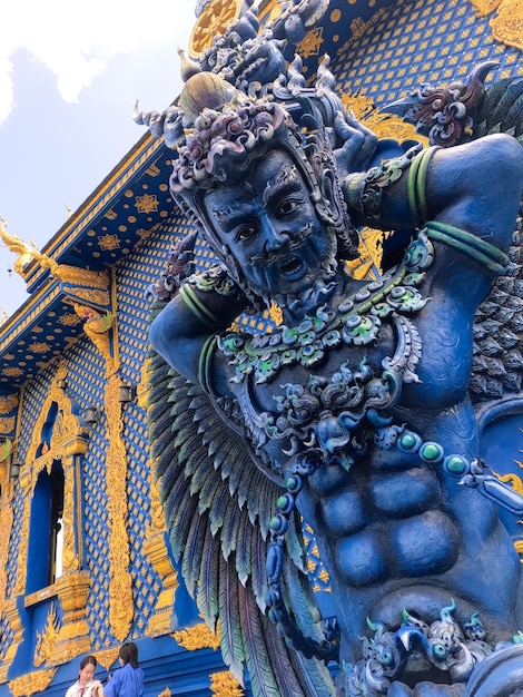 Traditional mythical wood sculpture of Wat Rong Suea Ten Blue Temple at Chiang Rai Thailand