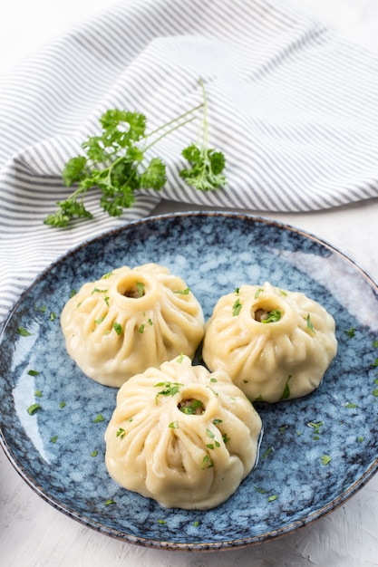 Traditional oriental food manti with meat on a plate