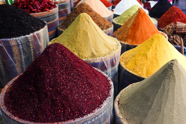 Traditional oriental spice market in Istanbul with various spices on the counter