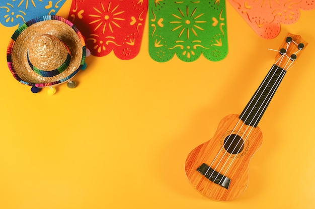 Traditional paper flag guitar and large sombrero for Cinco de Mayo holiday party celebration