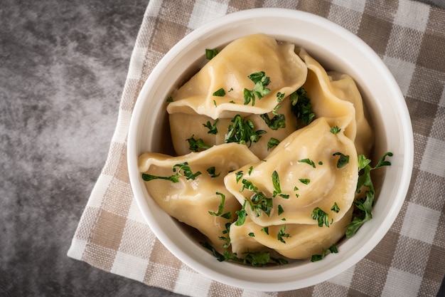 Traditional pelmeni, ravioli, dumplings with meat.