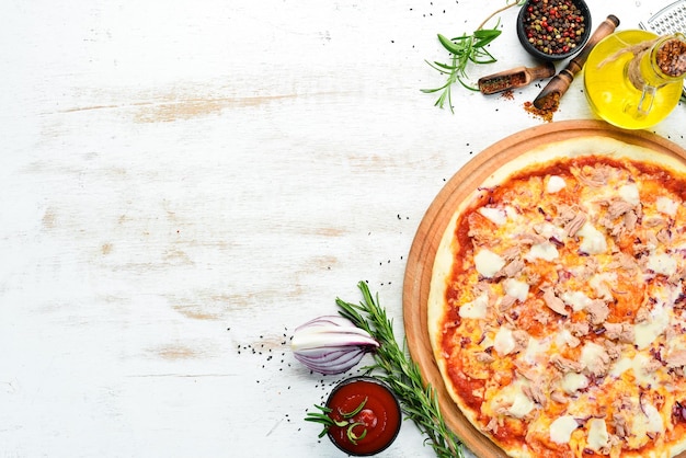 Traditional pizza with tuna and vegetables Top view free space for your text Rustic style