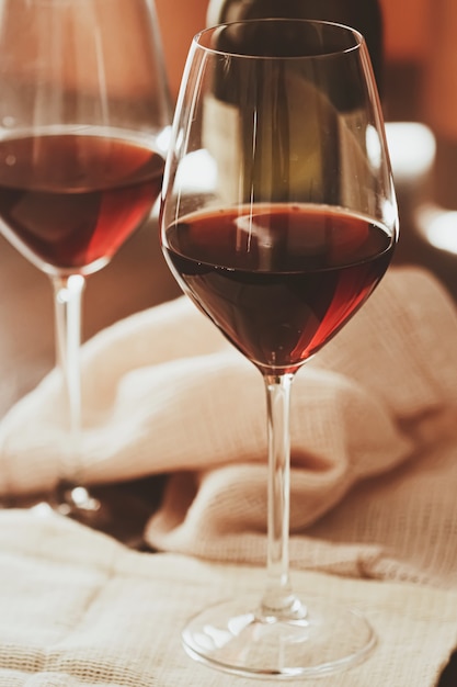 Traditional red house wine served in crystal glasses, closeup