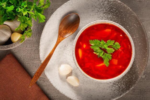 Traditional Russian borscht or red soup in the bowl Top view