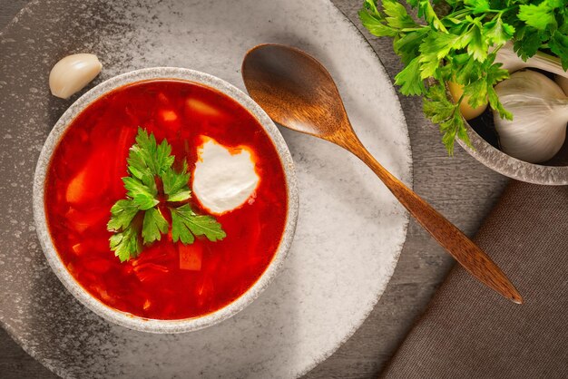 Traditional Russian borscht or red soup in the bowl Top view