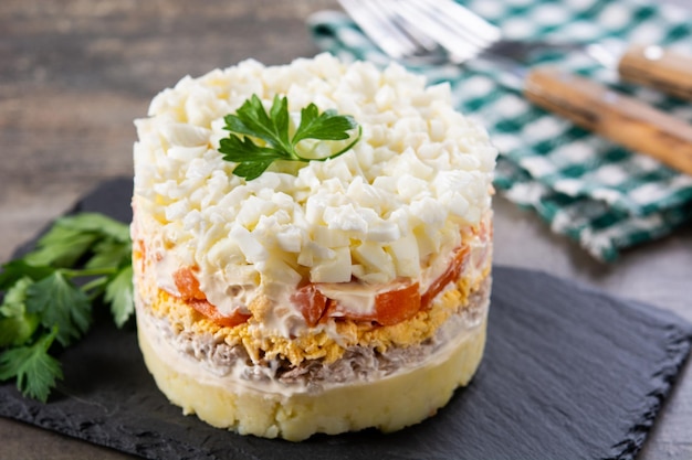 Traditional Russian layered salad Mimosa