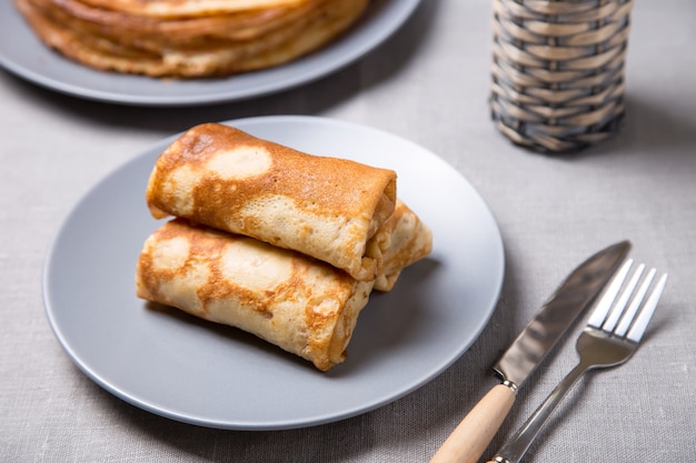 Traditional Russian pancakes with meat. Shrovetide. Maslenitsa week. Selective focus, close-up.