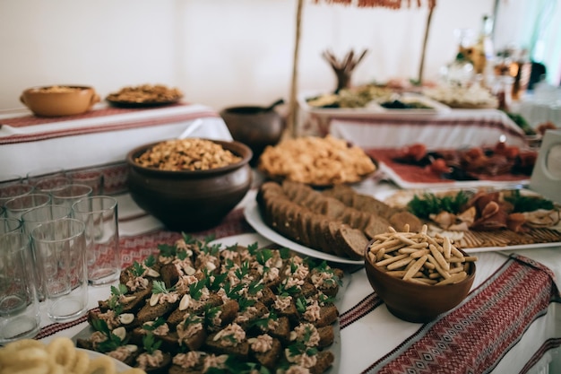 Traditional snacks of meat and nuts on the wedding table at the wedding ceremony