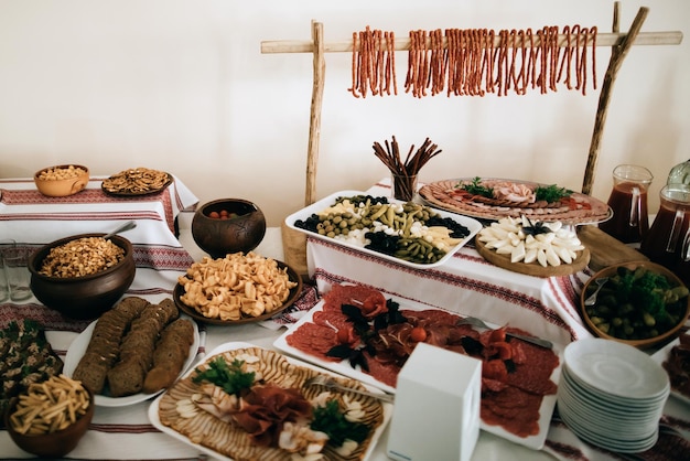 Traditional snacks of meat and nuts on the wedding table at the wedding ceremony