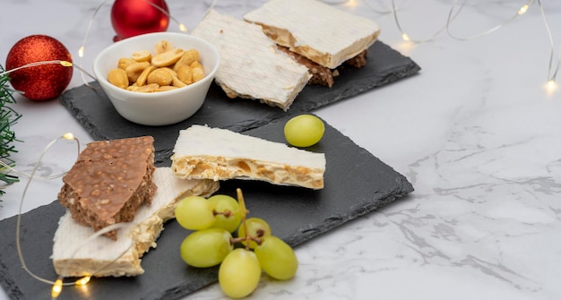 Traditional Spanish Christmas sweet Turron with Christmas lights in the background