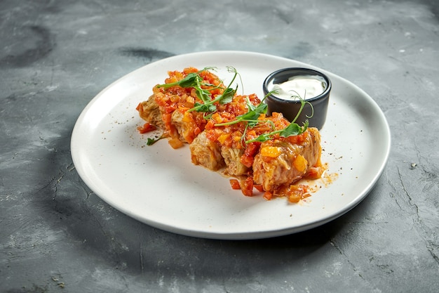 Traditional stuffed cabbage rolls with minced meat and rice stewed in tomato sauce