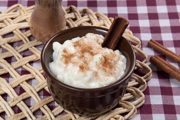 Traditional sweet from the Brazilian June festivals made of white corn with coconut and condensed milk and sprinkled with cinnamon