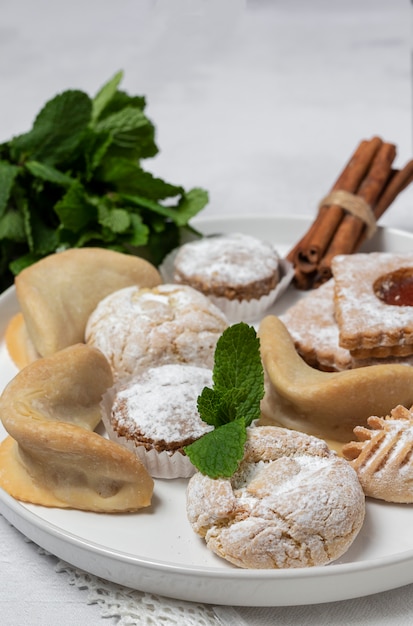 Traditional tea with mint and assorted Arab sweets