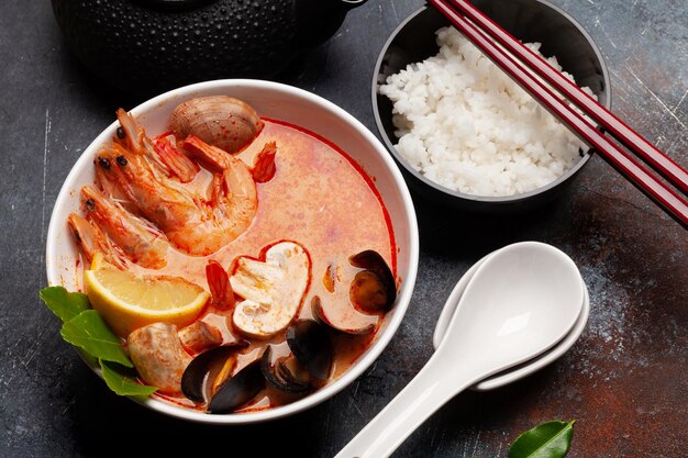 Traditional Thai soup Tom Yum and rice bowl