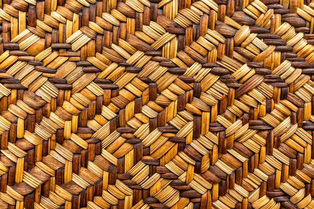 Photo traditional thai style pattern nature background of brown handicraft weave texture wicker surface for furniture material