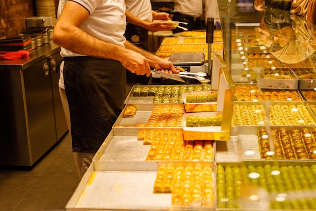 Traditional Turkish dessert Baklava closeup trays of delicious baklava displayed in showcase of baklavalari shop