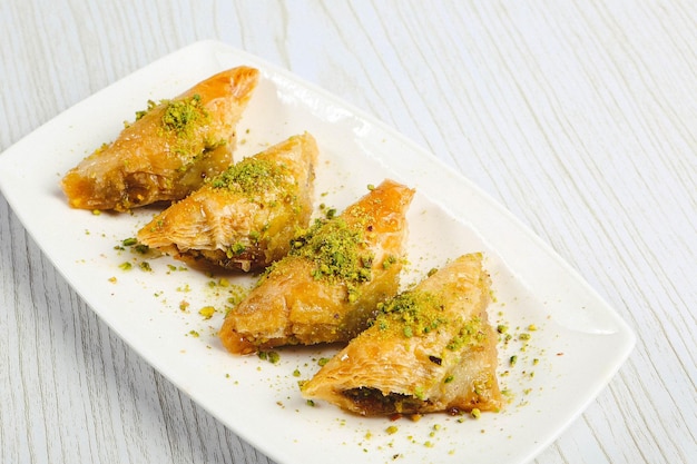 Traditional turkish dessert baklava with cashew, walnuts. Homemade baklava with nuts and honey.