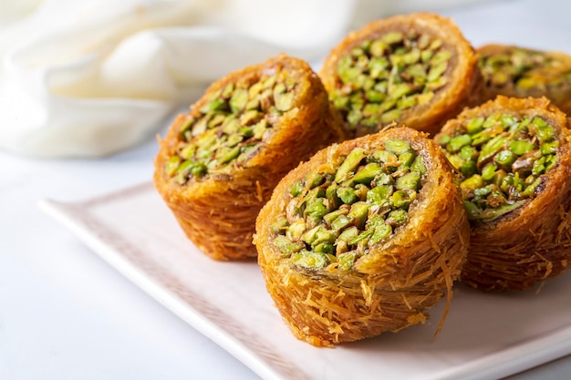 Traditional Turkish desserts; Kadaif stuffed with pistachios. Turkish name; Kadayif dolmasi or dolma kadayif