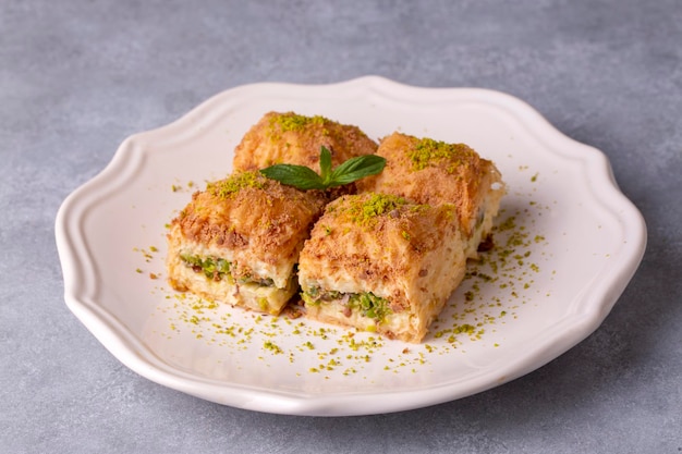 Traditional turkish new dessert cold milky baklava with pistachio (Turkish name; soguk baklava)