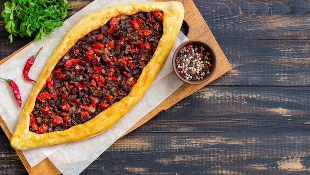 Traditional Turkish pide with meat. Turkish cuisine. National food.