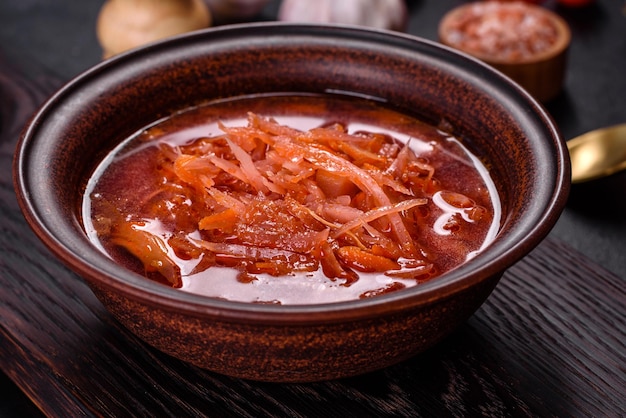 Traditional Ukrainian borscht with beets tomatoes garlic spices and herbs Ukrainian dish traditional food