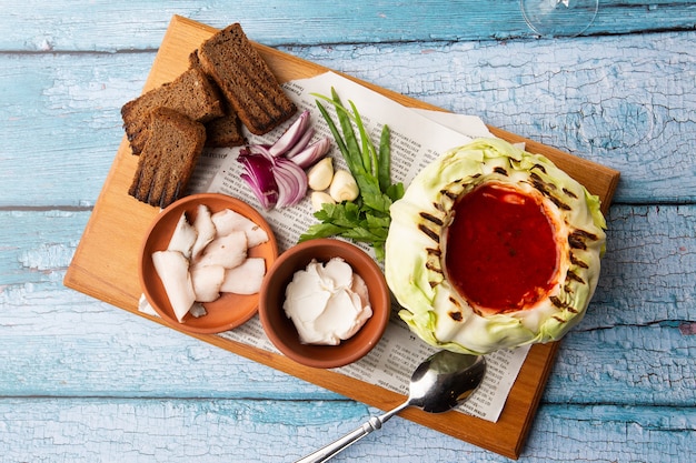 Traditional Ukrainian borscht with white beans on the cabbage bowl 