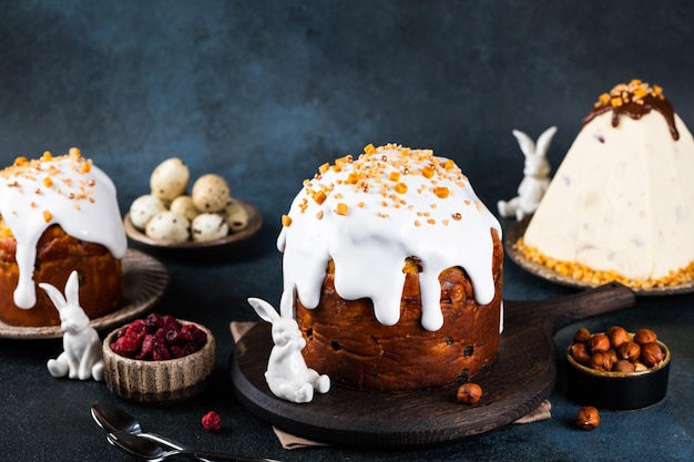 Traditional ukrainian easter cake with marshmallow glaze Cottage cheese paskha Easter table with traditional dessert Easter bunny Russian kulich