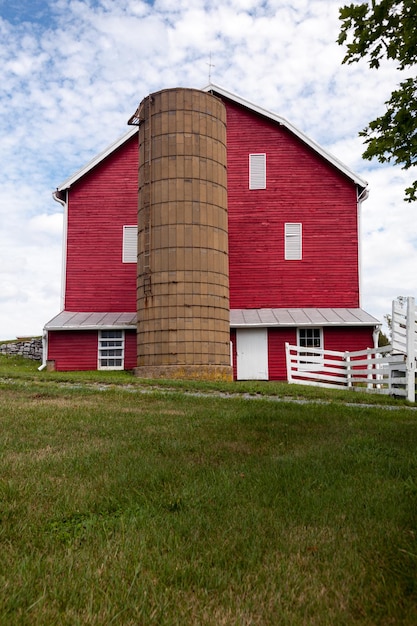 Traditional US red painted barn on farm