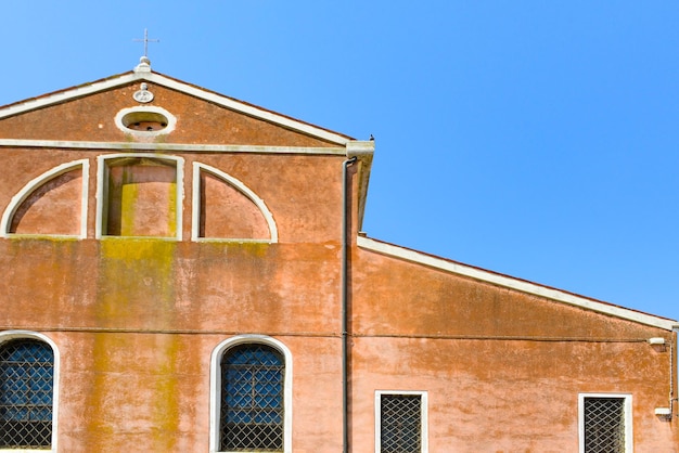 Traditional vintage windows with old house in historic Burano island Venice Italy