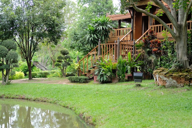 Traditional wooden home house near pond