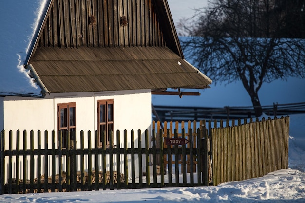 Traditional wooden timbered cottage in winter Folk museum in Vesely Kopec Czech Republic