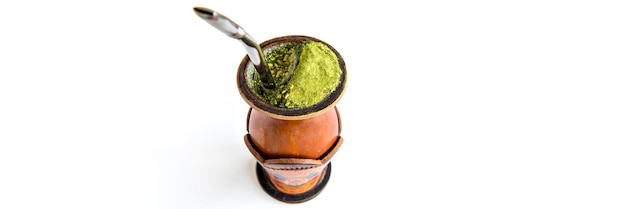 Traditional yerba mate tea chimarrao gaucho from southern Brazil outdoor format white background