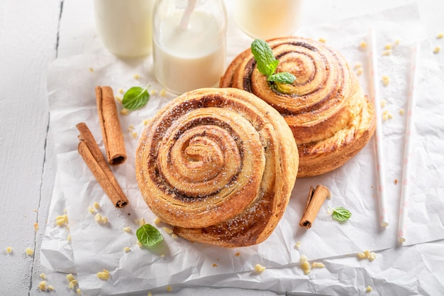 Traditionally and tasty cinnamon rolls served with milk