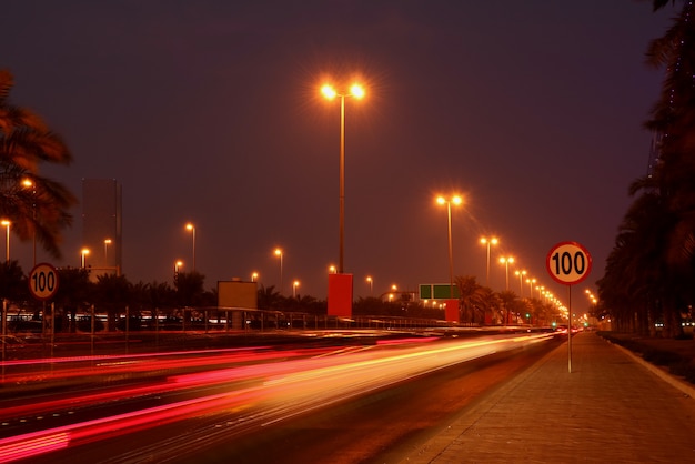 Traffic in the city at night with vivid color car light trails