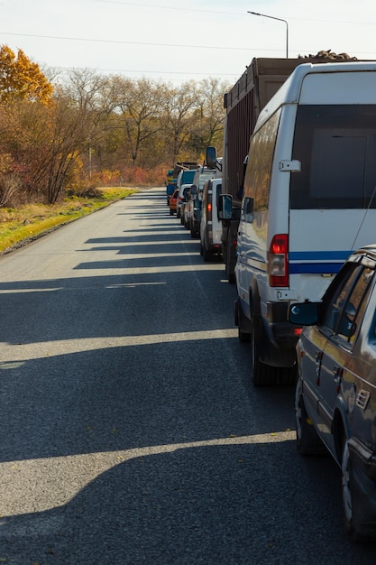 Traffic jam on busy road cars in row