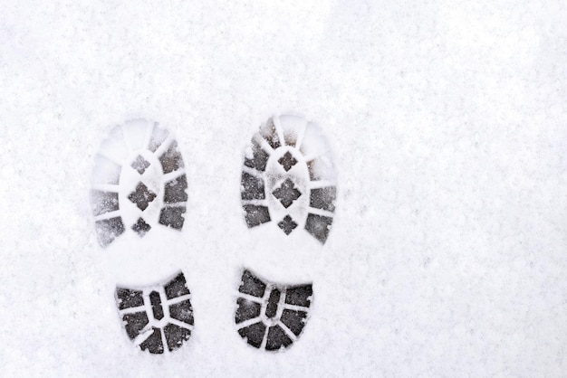 Trail of shoes in the snow tread in the snow High quality photo