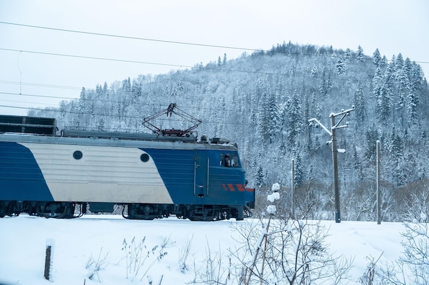 Train locomotive at winter mountains