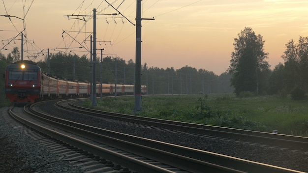 Train turning and passing by outside the town