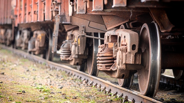 Train wheels closeup, selective focus. Rolling stock on track.