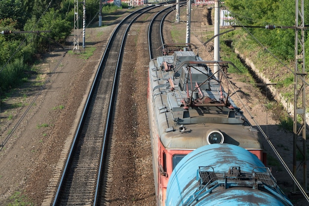 Train with tank cars on the railroad tracks, top view