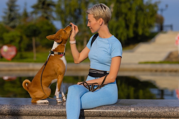 Trained intelligent dog taking food from human