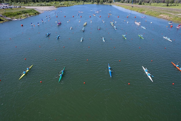 Training of rowers on kayaks and canoes on rowing channel top view